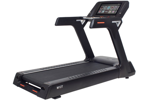 Black commercial treadmill with touch screen console, orange accent trim, and cushioned running deck on white background