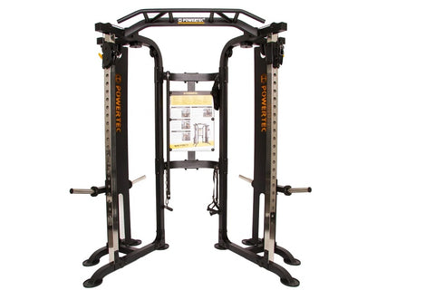 Black and silver dual-sided functional trainer with cable machines, adjustable arms, and instruction placard on white backgro