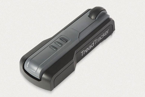 Black Treadtracker fitness device with three button controls and curved design on white background