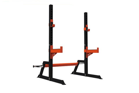 Warrior Deluxe Squat Stand with black uprights, red safety arms and connecting bar on white background